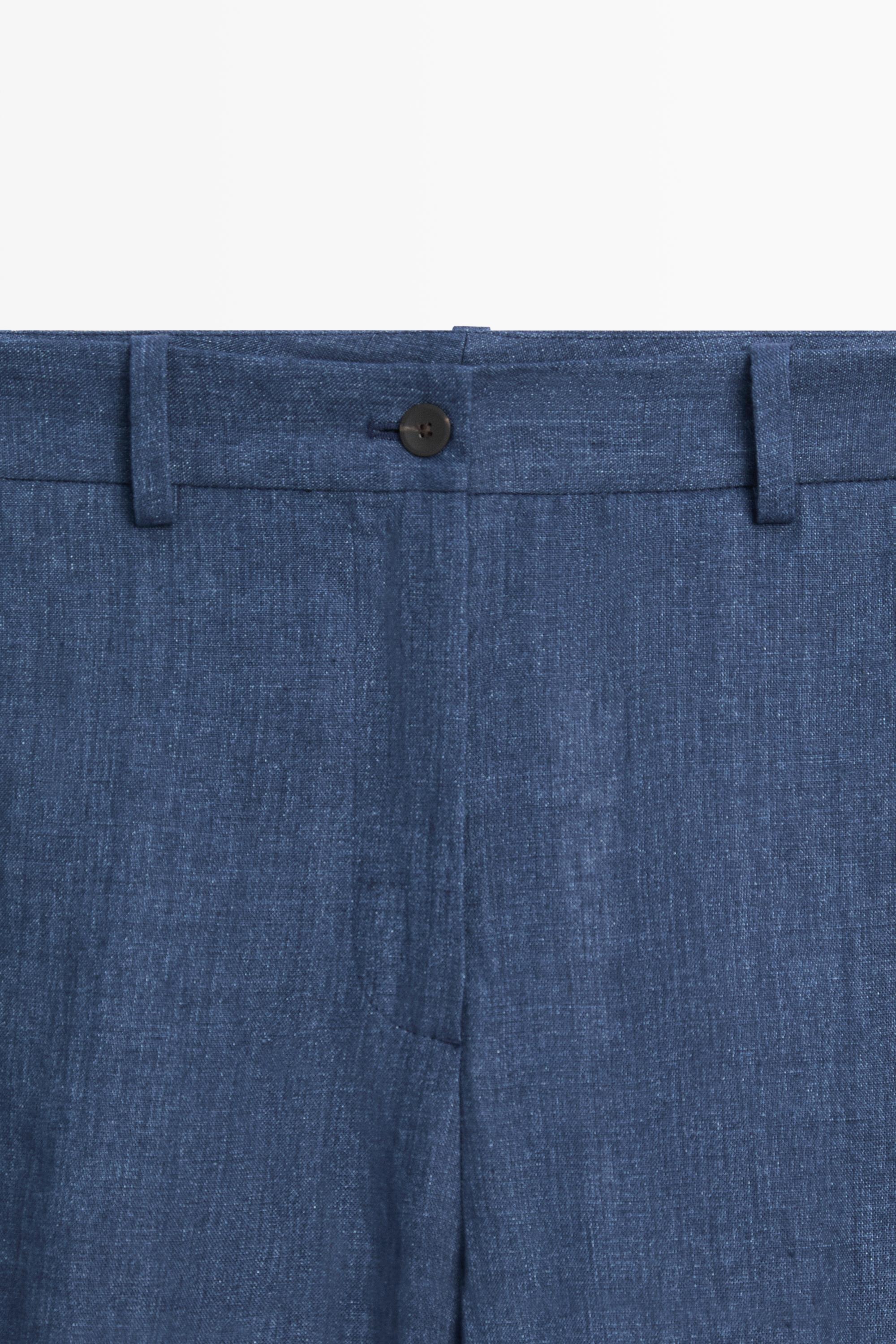Total look linen pants with buttoned hems